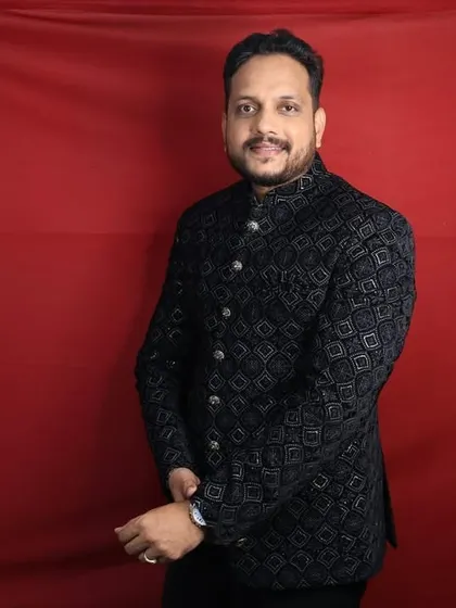 For a royal and elegant look, rent this black patterned Jodhpuri suit. It's perfect for weddings and receptions. You can see the detail of the fabric and the fit in this shot, taken with our studio ring light.