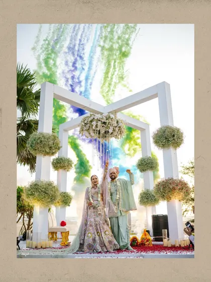 A spectacular exit with colorful smoke bombs creating a vibrant backdrop for the happy couple.