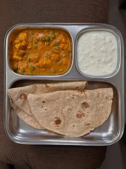 A classic comfort meal of chapati with paneer and peas curry, served with a side of curd. Simple, delicious, and nutritious.