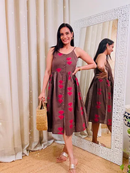 This brown dress with a red heart print is a quirky and fun piece. It's a great conversation starter.