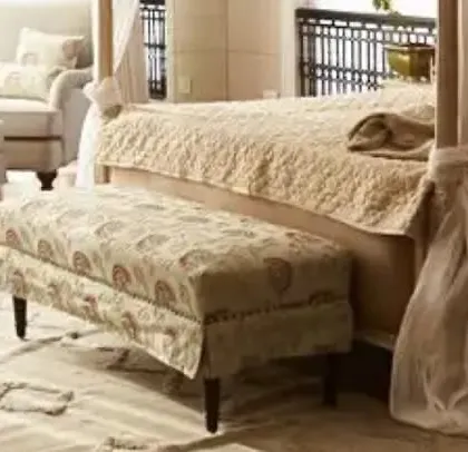 A full view of the bedroom from our collaboration with Tarun Tahiliani in Goa. The space features a four-poster bed, a patterned bench, and classic armchairs, all designed to create a cohesive and luxurious retreat.