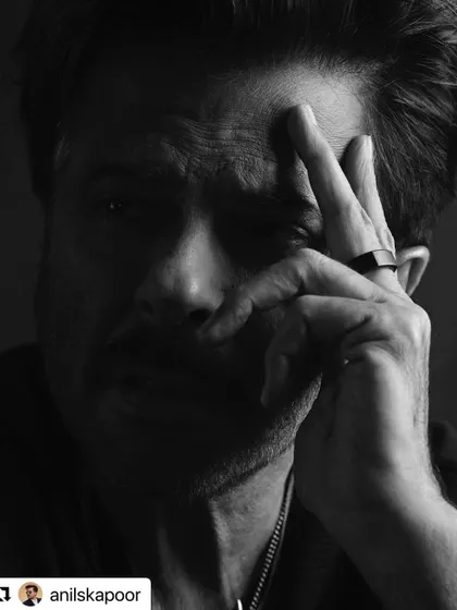 An intense, shadowed portrait of Anil Kapoor.