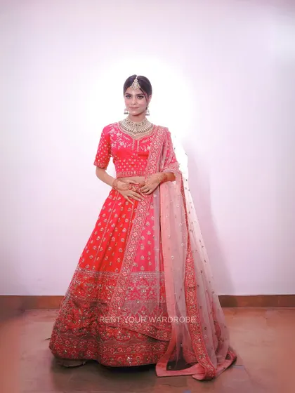 A full-length view of the pink lehenga, a perfect example of our pretty and affordable collection.