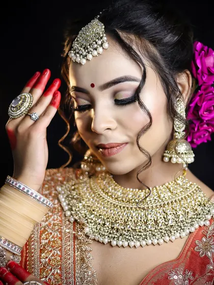 The focus here is on the soft, blended eye makeup and the intricate details of the jewelry. Students learn to create looks that are both delicate and impactful.