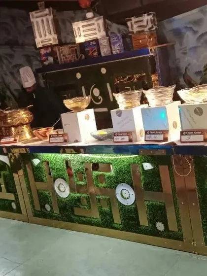 This close-up shows the details of our green custom counter, including the integrated display boxes for showcasing different food items.
