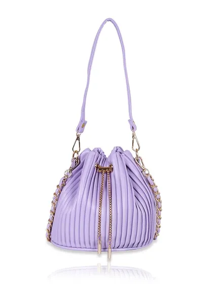 A front view of the lavender bucket bag, clearly showing the drawstring and straps.