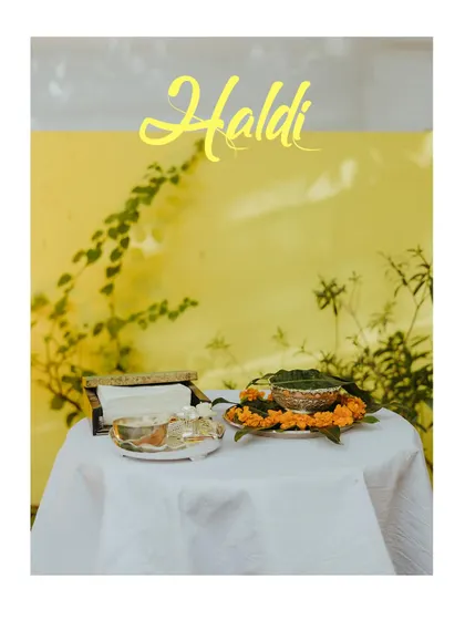 A simple, elegant shot of the Haldi ceremony setup, focusing on the traditional elements.