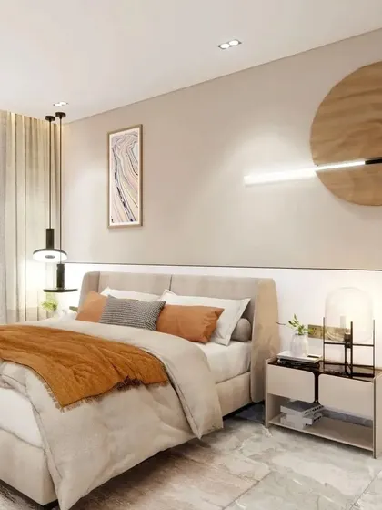 Another angle of the minimalist bedroom, showing the clean lines and calm color palette. The pendant lights and bedside lamp add layers of lighting to the space.