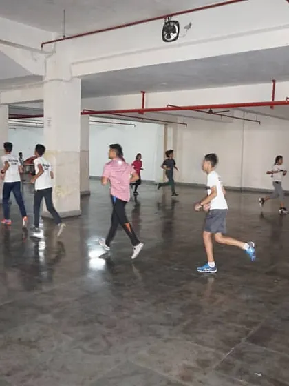 A group of fencers running laps in our training facility. Building stamina is a non-negotiable part of our competitive fencing program.