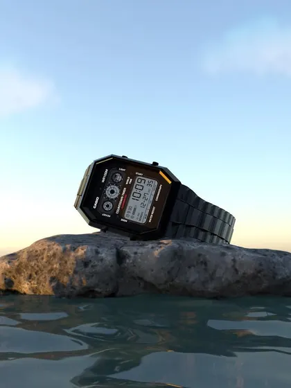 Another render of the Casio watch 3D model, this time set on a wet rock at the water's edge during sunset. This demonstrates how lighting and environment can completely change the mood of a product visualization.