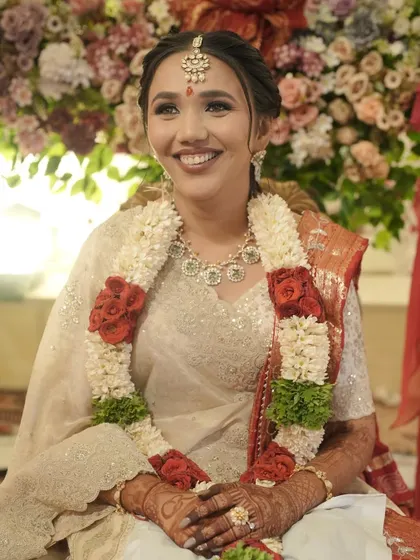 A close-up of the bride's happy face, her smile infectious and her makeup glowing.