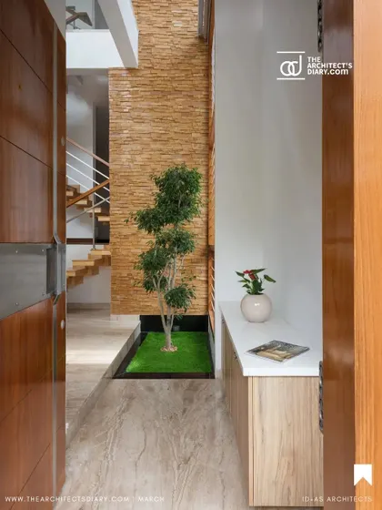 The entrance to the Cube House reveals a small internal courtyard, which acts as a buffer between the outside world and the private home. This feature immediately introduces our theme of integrating nature into the architecture.