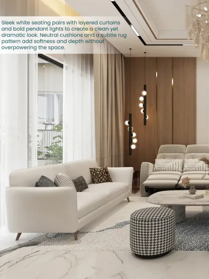 Sleek white seating pairs with layered curtains and bold pendant lights to create a clean yet dramatic look in this living space.