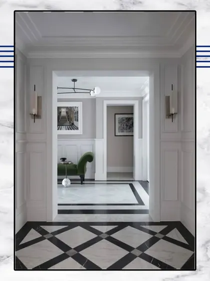 Experience opulence in every corner. This hallway uses a classic black-and-white diamond-patterned marble floor and clean wall paneling to create a modern masterpiece.