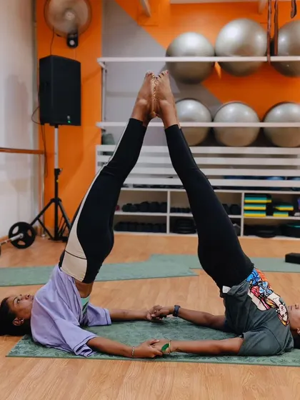 Finding perfect symmetry and balance with a partner. These shared yoga poses are a fun way to deepen your stretches and improve alignment together.