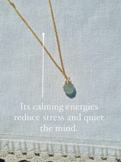 Another shot of the Aquamarine Melon Pendant, a stone of soothing and enlightenment.