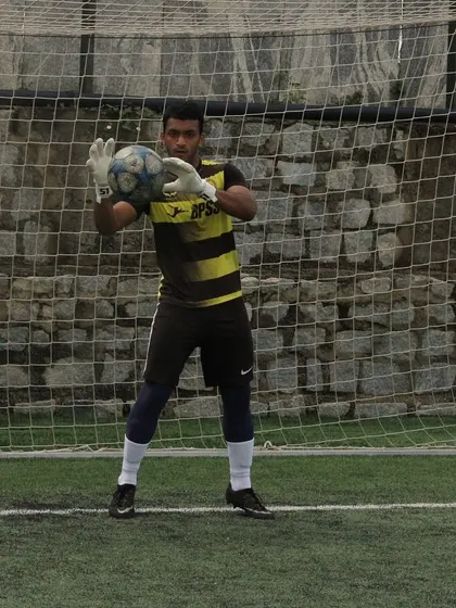 Akash Kola in his goalkeeping stance. His story inspires many young players in our academy.