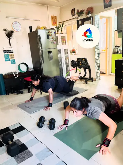 Two clients perform modified push-ups, building upper body strength. I tailor exercises to each individual's level, ensuring a safe and effective workout.