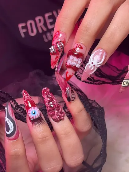 A full look at both hands of this epic Halloween manicure, showing all the different spooky elements working together.