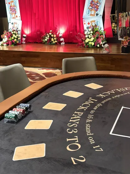 Another view of the blackjack table, set against the backdrop of the grand stage, showing how we integrate interactive elements seamlessly into the overall decor.