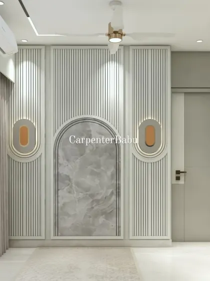 A close-up of a wall featuring vertical fluting and an arched niche with a marble inlay. The design is a modern take on classic architectural details.