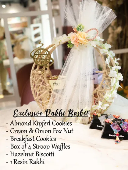 Our Exclusive Rakhi Basket is designed to impress. This beautifully decorated basket is filled with a variety of our handmade cookies like Almond Kipferl and Hazelnut Biscotti, along with stroop waffles and cream & onion fox nuts.