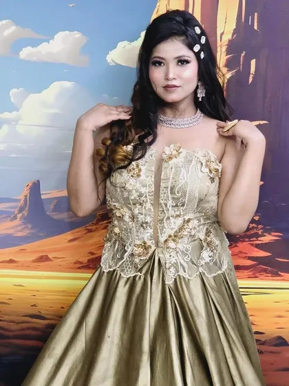 This model is wearing a champagne-coloured gown with a delicate American Diamond choker. It's a subtle yet glamorous choice for a modern event.