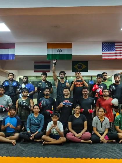 Mid week fury. The team after a Wednesday striking class, with one member raising his fist in triumph.
