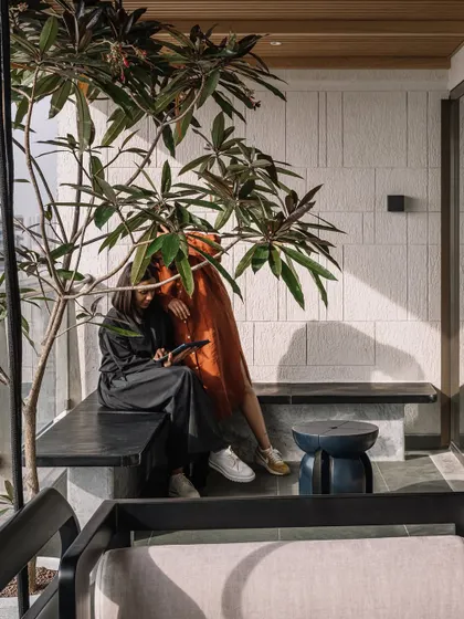 A moment of quiet conversation on the deck, showcasing how the space is designed for human connection.