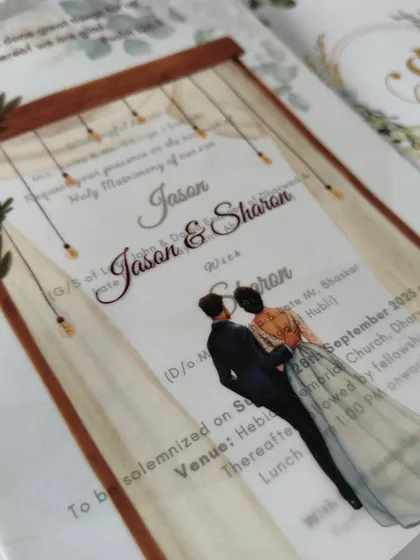 A close-up of the vellum overlay with the couple's portrait. This is a wonderful way to personalize your invitation and share a piece of your story with your guests.