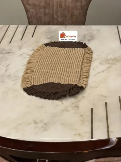The table mat on a marble table, showing its size and how it can be used as a centerpiece.
