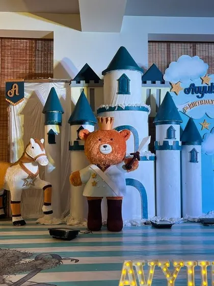 A close up of the teddy bear prince and his horse in the 3D castle themed setup, highlighting the detailed props.