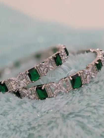 Another view of the emerald and AD bangles.