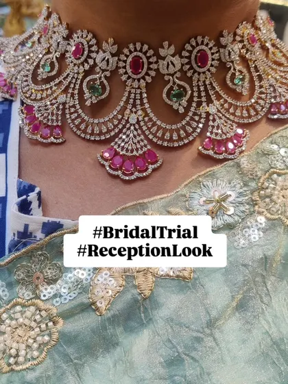 This bride-to-be is testing out a grand American diamond and ruby choker for her reception. Bridal trials are key to mixing and matching pieces to create a confident and personalized look.