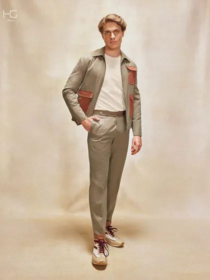 This ensemble, featuring a neutral-toned shacket with contrasting leather pocket details, is designed to capture attention the moment you enter a room with its unique, fashion-forward look.