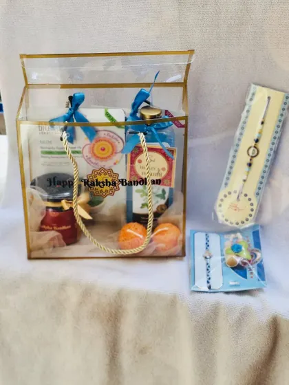 This Rakhi gift set includes a hamper bag and beautifully packaged rakhis on the side.
