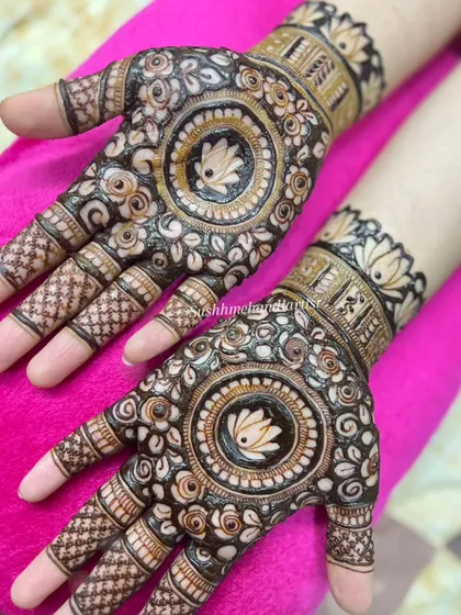 The beauty of a mandala is in its symmetry. This is a classic yet modern choice, with a central lotus surrounded by detailed patterns that look elegant on any occasion.