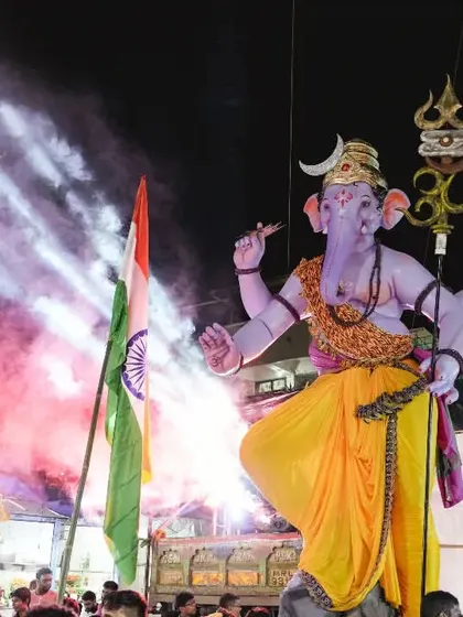 A dramatic night shot from the Kopri Cha Samrat procession. Using colored smoke and spotlights, I framed the massive idol to create a powerful and memorable image that reflects the festival's high energy.