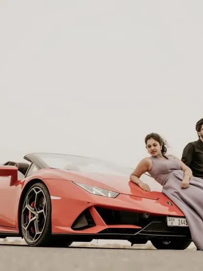 A wide shot showing the scale of the Lamborghini against the vast desert landscape.