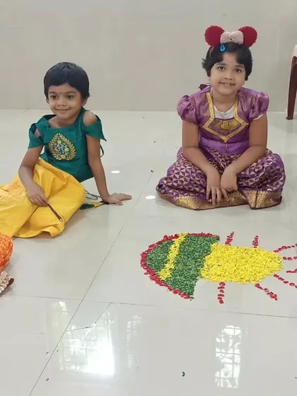 Another group of happy campers with their beautiful Pookalam. These creative projects are a key part of our summer fun, encouraging teamwork and artistic expression.