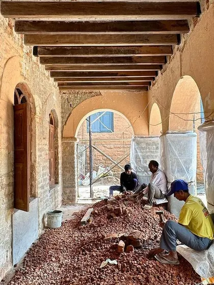 A repeat image of workers clearing the corridor, signaling progress in the restoration.