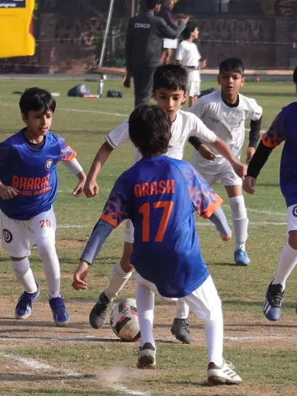 Our Under 9 team giving their all. This photo captures the energy and determination of our players during a competitive game.