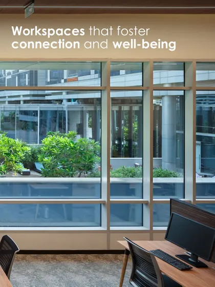 A workspace at the APT office positioned to overlook a green courtyard. This image perfectly captures our philosophy of designing workspaces that foster connection with nature and enhance employee well-being.