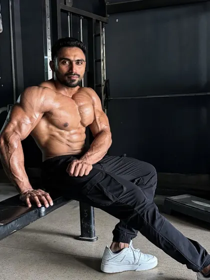 A full-body shot, showing the results of consistent training.