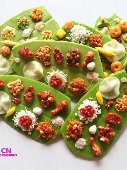 A collection of non-veg leaf meal magnets, featuring dishes like chicken curry and fish fry.