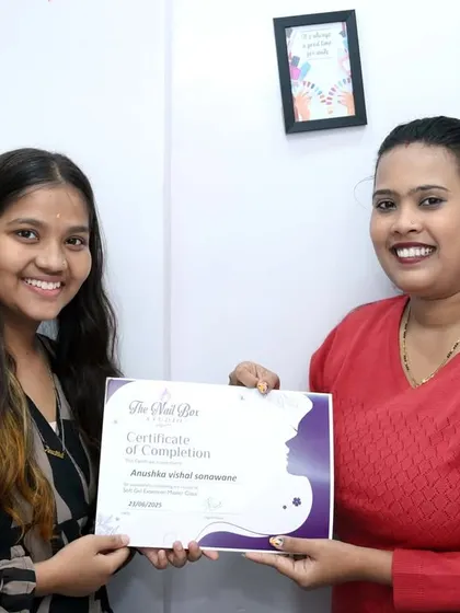 A happy moment with my student as she receives her certificate. I wish her all the success in her new career as a nail artist.