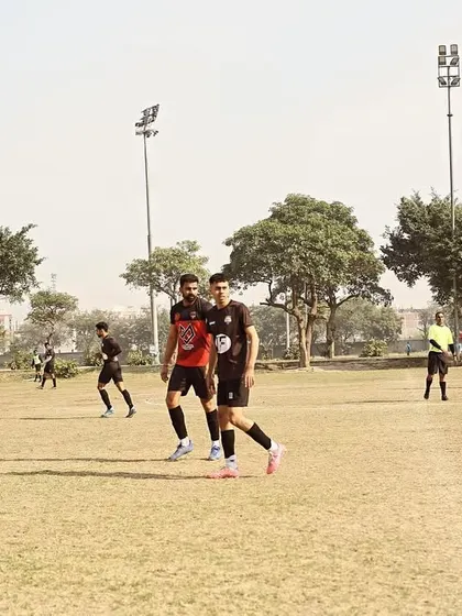 An action shot from our Gameday 1 fixture in the Super League, with players walking the pitch during a break.