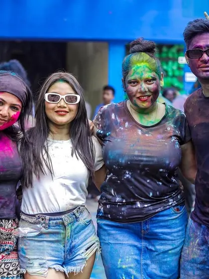 A group of friends smiling through the Holi colors. It was a day of pure joy and celebration.