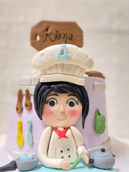 A master chef in the making. This cake, with a pistachio buttercream and strawberry filling, was designed for a 4-year-old who loves to cook.