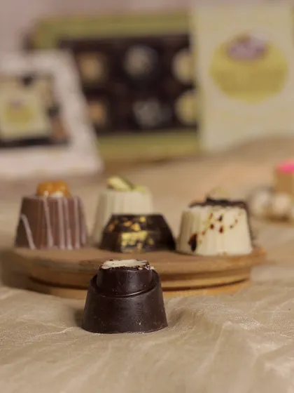 The almond nougat soft-centered chocolate, a rich dark chocolate piece with a crunchy and chewy nougat filling. It's a perfect balance of textures and flavors.